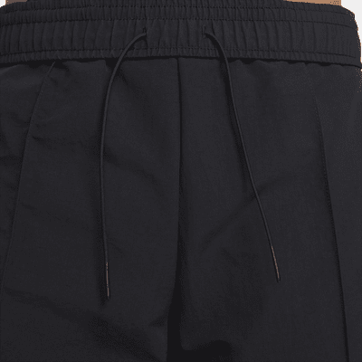 Nike Nike Sportswear Everything WovensPantalón de talle medio con dobladillo abierto - Mujer Los más vendidos