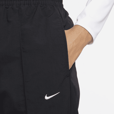 Nike Nike Sportswear Everything WovensPantalón de talle medio con dobladillo abierto - Mujer Los más vendidos
