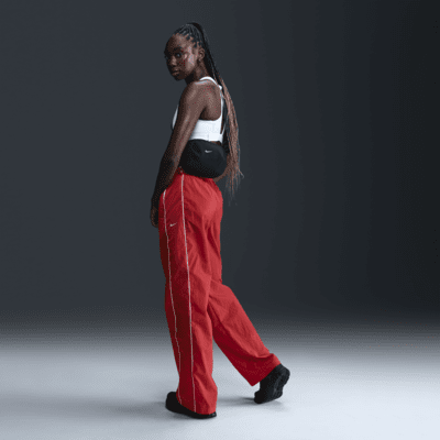Nike Nike WindrunnerPantalón de talle alto y tejido Woven con dobladillo abierto - Mujer Última moda