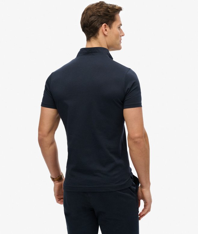 superdry Polo de punto fluorescente con logotipo Essential Promoción trimestral